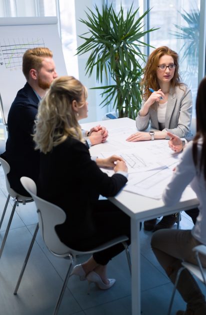 Group of young architects working together on project