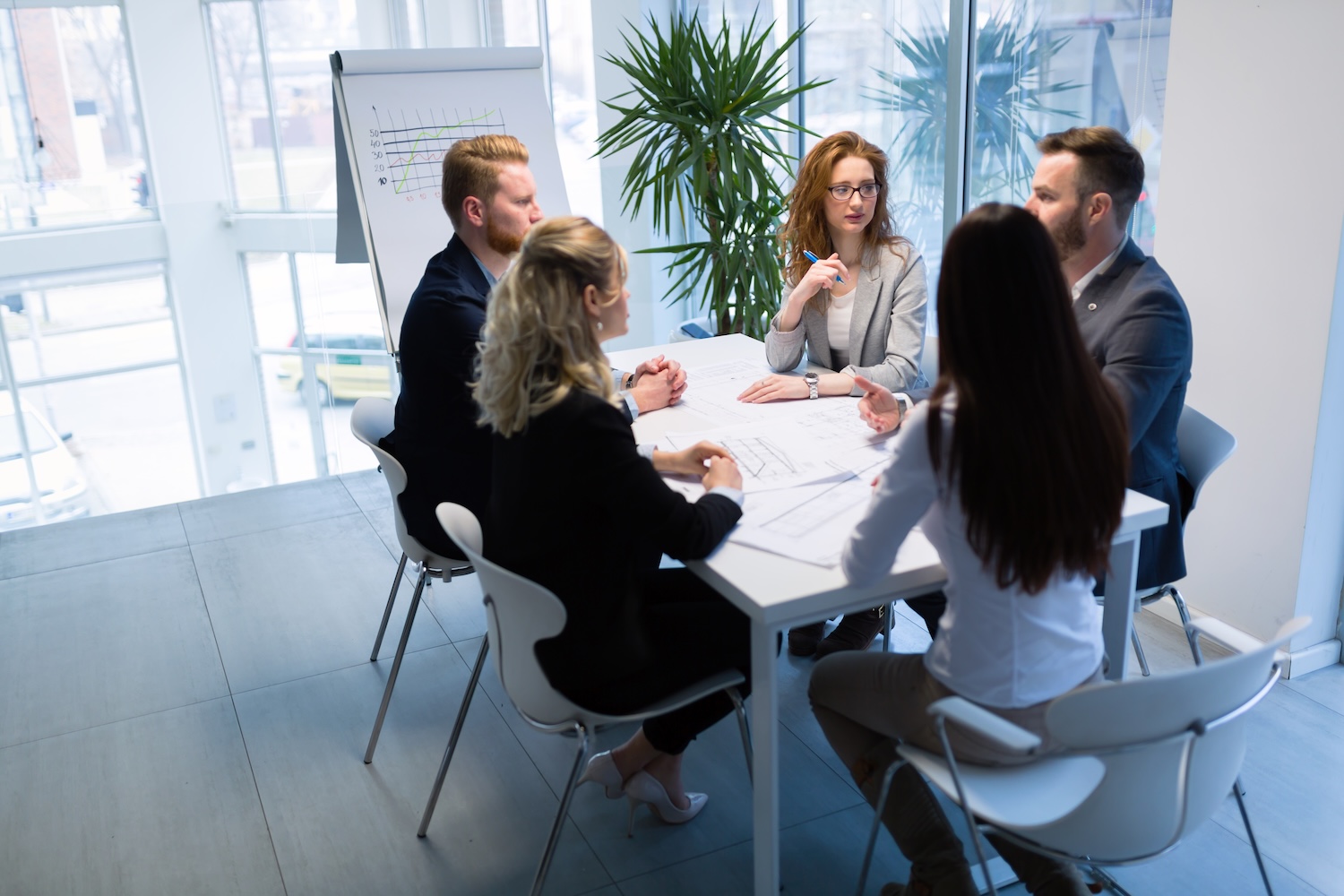 Group of young architects working together on project